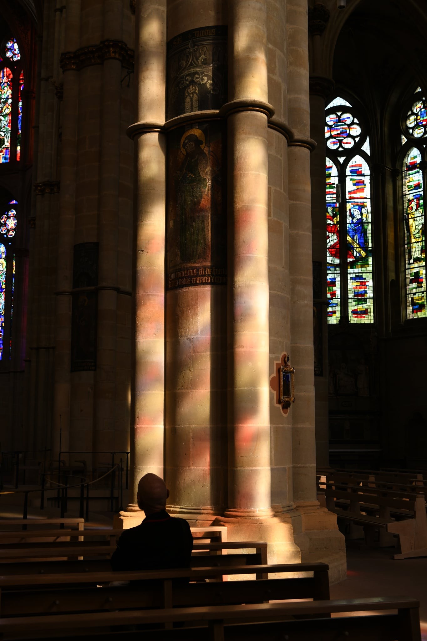 Light through stained glass on a pillar of Trier Cathedral